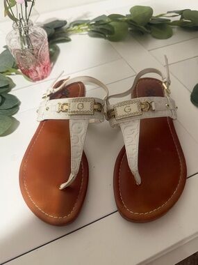 G by Guess White Embossed T-Strap Sandals with Gold Accents
